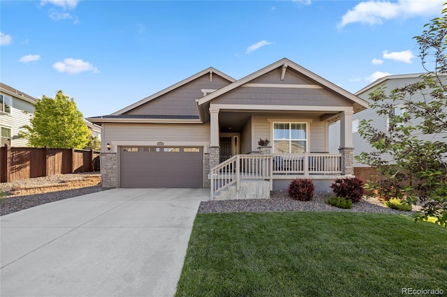 14431 Forest St, Thornton, CO 80602 - craftsman house with concrete driveway, an attached garage, a porch, and stone siding