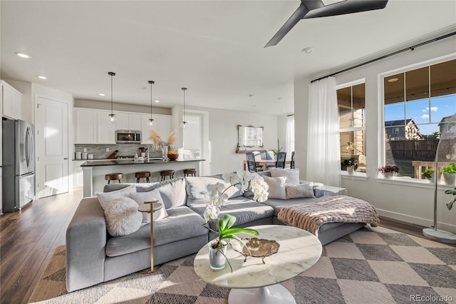 14431 Forest St, Thornton, CO 80602 - living area featuring wood finished floors, recessed lighting, and a ceiling fan