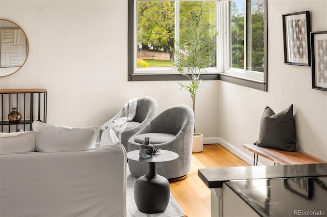sitting room featuring wood finished floors and baseboards
