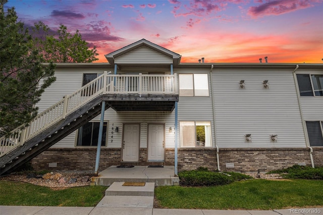 18038 Becket Dr, Parker, CO 80134 - view of front of house featuring stairs, brick siding, and a deck