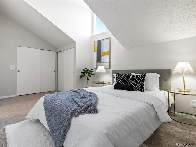 bedroom with lofted ceiling, carpet, baseboards, and a textured ceiling