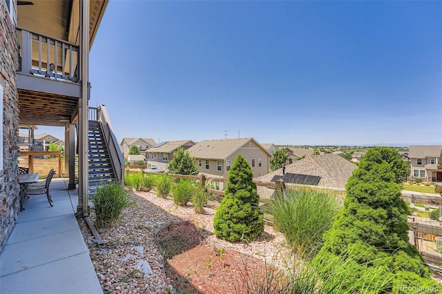 7845 S Flat Rock Way, Aurora, CO 80016 - view of yard featuring stairway and a residential view