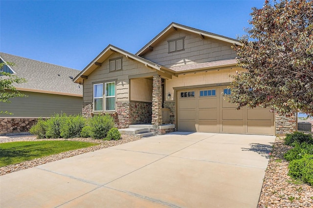7845 S Flat Rock Way, Aurora, CO 80016 - craftsman-style house with stone siding, concrete driveway, and an attached garage