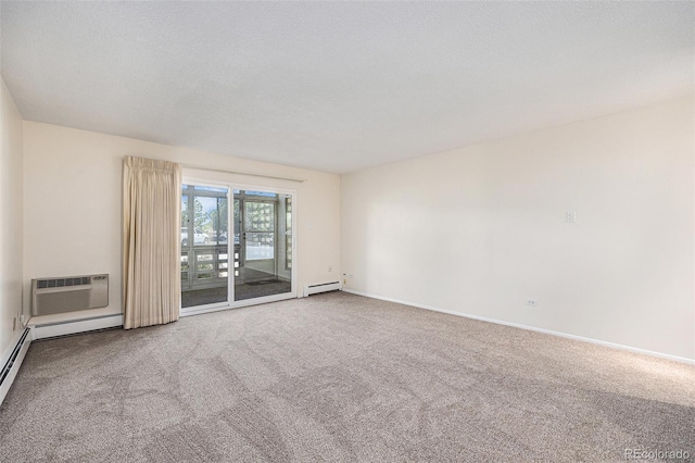 350 S Clinton St Unit 2A, Denver, CO 80247 - carpeted spare room featuring a baseboard heating unit and an AC wall unit