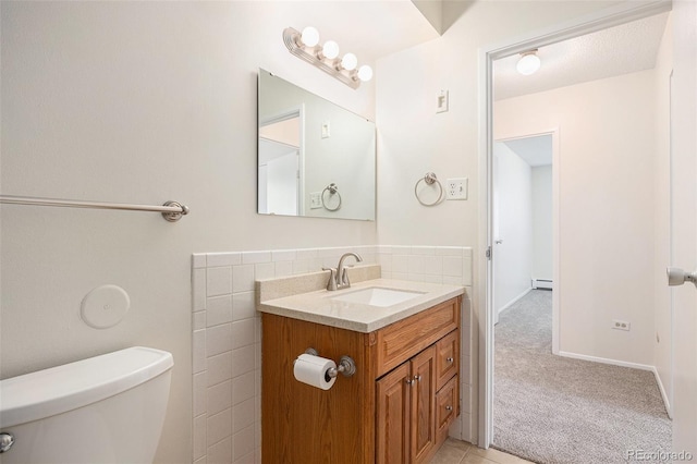 350 S Clinton St Unit 2A, Denver, CO 80247 - half bathroom featuring vanity and a baseboard heating unit