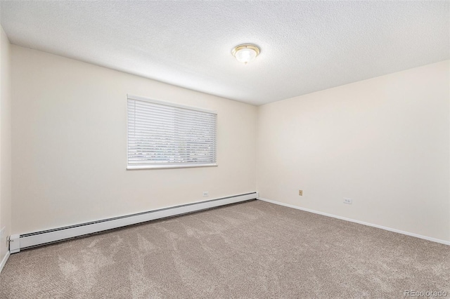 350 S Clinton St Unit 2A, Denver, CO 80247 - carpeted empty room featuring a baseboard heating unit and a textured ceiling