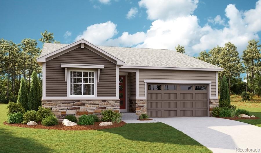 view of front of home with a garage and a front lawn