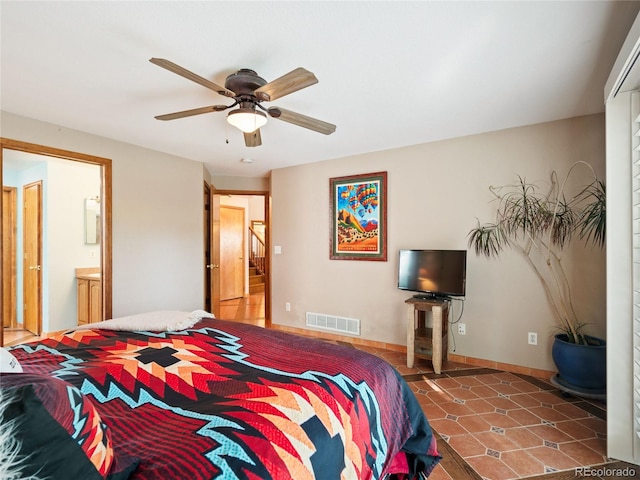 bedroom with ensuite bathroom and ceiling fan