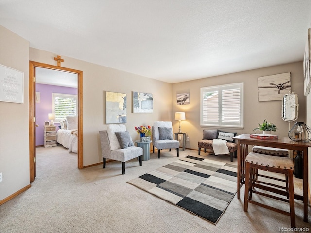 living area featuring light carpet