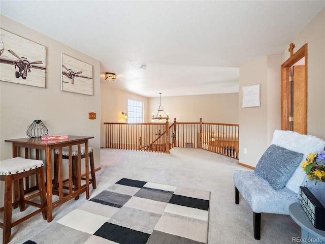 living area featuring an inviting chandelier and light colored carpet