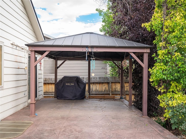 view of patio with a gazebo and a grill