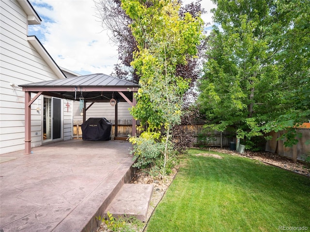 view of yard featuring a gazebo and a patio area