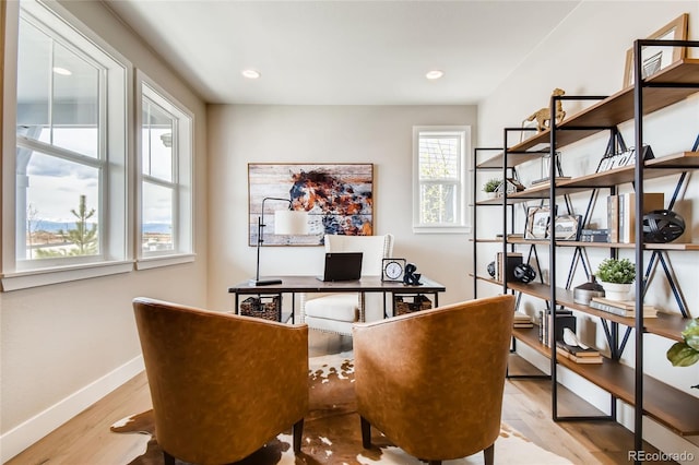 office area with recessed lighting, light wood-type flooring, and baseboards