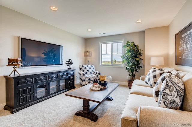 carpeted living area featuring visible vents, baseboards, and recessed lighting