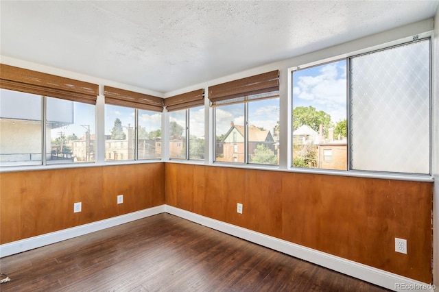 1255 N Ogden St Unit 305, Denver, CO 80218 - unfurnished sunroom featuring healthy amount of natural light and hardwood / wood-style floors