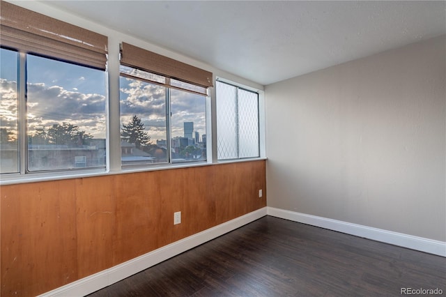 1255 N Ogden St Unit 305, Denver, CO 80218 - unfurnished room featuring baseboards and wood finished floors