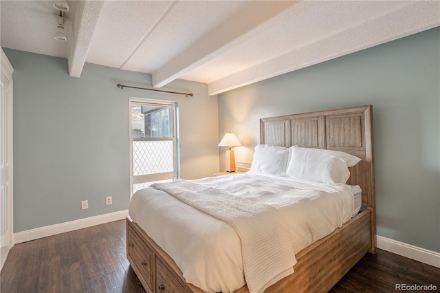 1255 N Ogden St Unit 305, Denver, CO 80218 - bedroom featuring beam ceiling, dark wood-style floors, and a textured ceiling