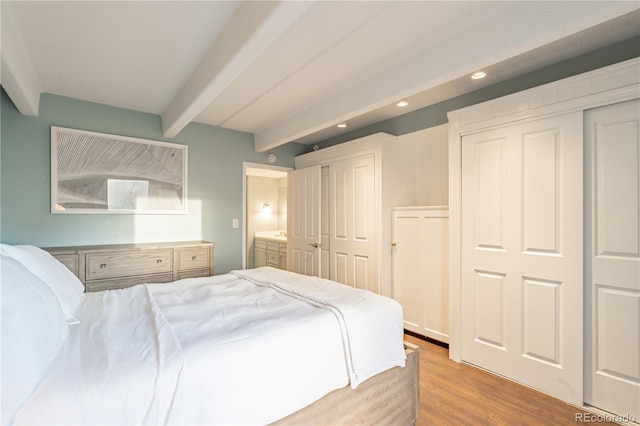 1255 N Ogden St Unit 305, Denver, CO 80218 - bedroom with beam ceiling, recessed lighting, and wood finished floors