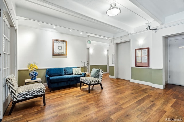 1255 N Ogden St Unit 305, Denver, CO 80218 - living room featuring wood finished floors and beamed ceiling