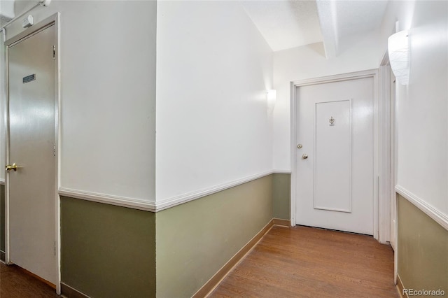 1255 N Ogden St Unit 305, Denver, CO 80218 - corridor featuring wood finished floors and beam ceiling
