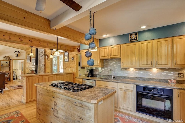 kitchen with a sink, black appliances, beamed ceiling, backsplash, and a center island