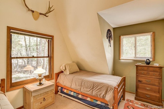 bedroom featuring light carpet