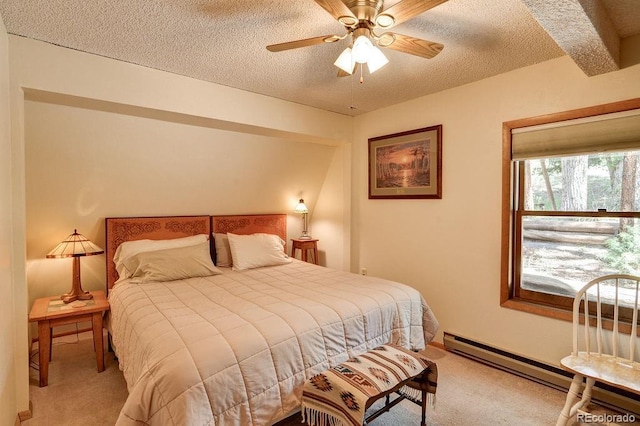 bedroom with baseboard heating, a textured ceiling, a ceiling fan, and carpet floors