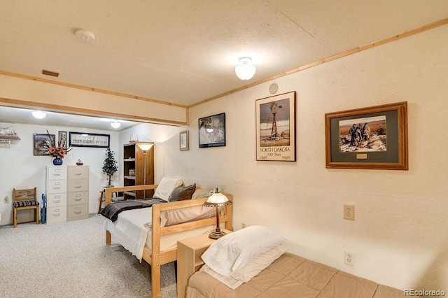 carpeted bedroom featuring ornamental molding