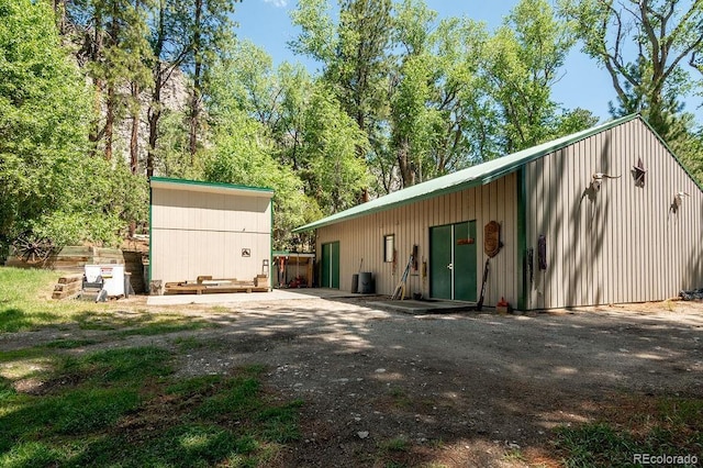 rear view of house with an outbuilding