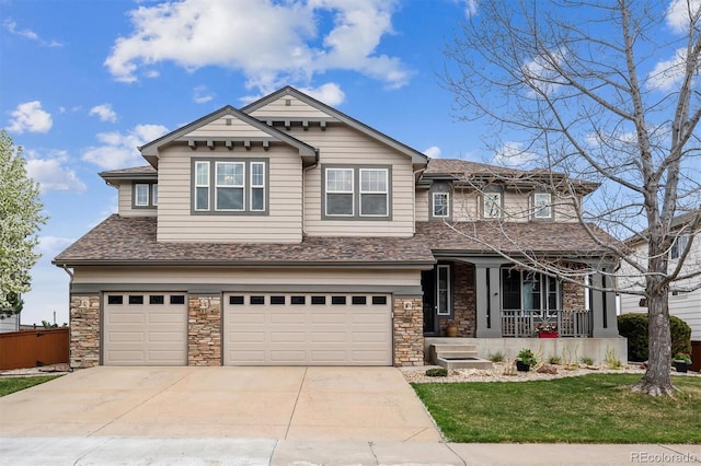 craftsman inspired home with concrete driveway, stone siding, covered porch, and an attached garage