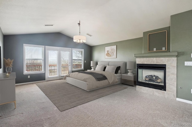 bedroom featuring carpet, visible vents, baseboards, and lofted ceiling