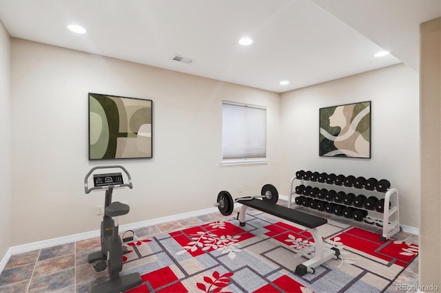 workout area with stone finish flooring, baseboards, visible vents, and recessed lighting