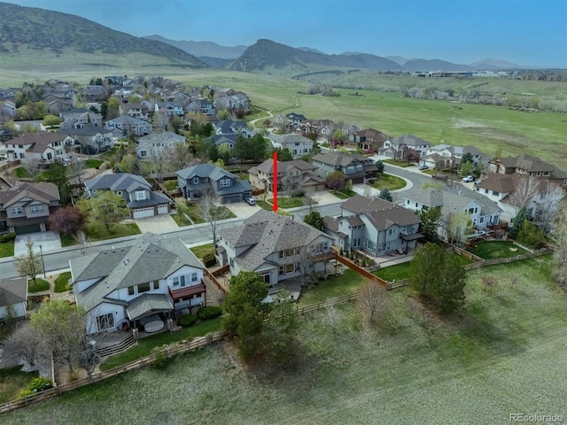 drone / aerial view featuring a mountain view and a residential view