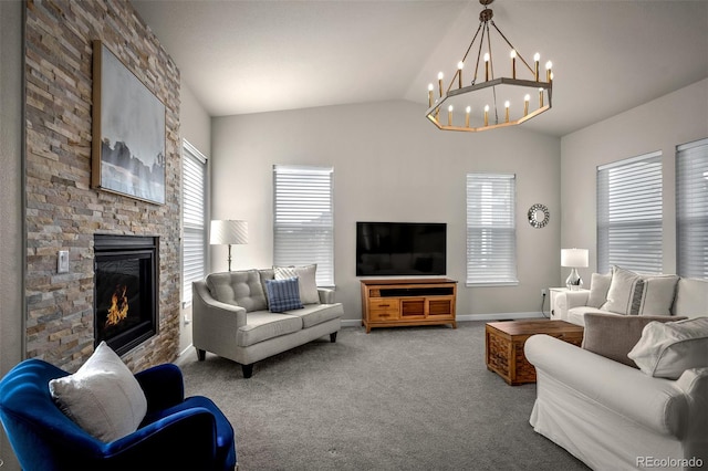 carpeted living room featuring a notable chandelier, a stone fireplace, baseboards, and lofted ceiling