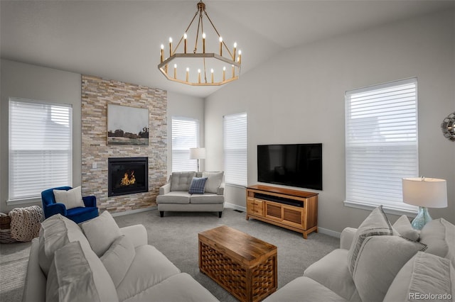 living room featuring light carpet, a stone fireplace, baseboards, a chandelier, and vaulted ceiling