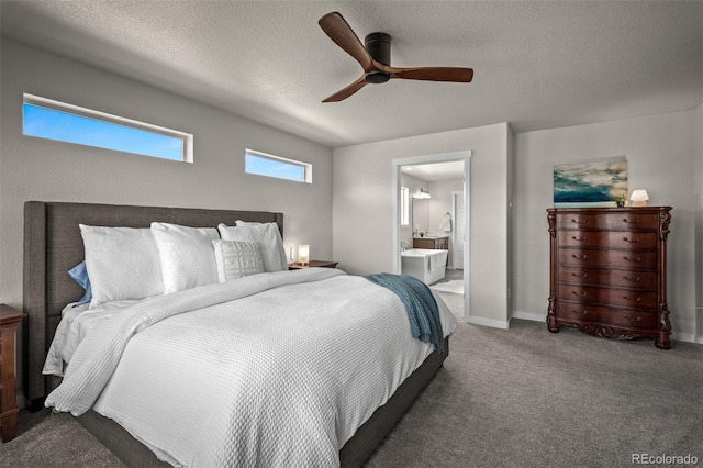 bedroom featuring a ceiling fan, baseboards, ensuite bathroom, a textured ceiling, and carpet flooring