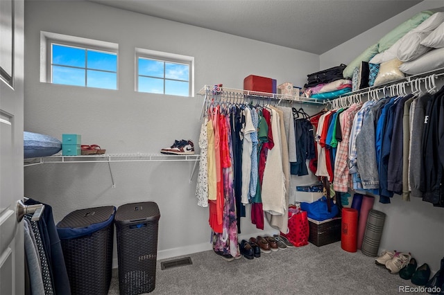 walk in closet with carpet flooring and visible vents