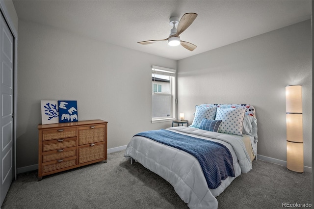 bedroom featuring ceiling fan, baseboards, and carpet