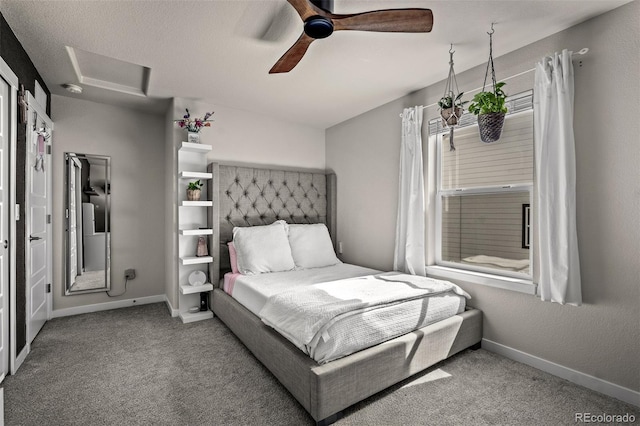 bedroom with attic access, carpet flooring, baseboards, and ceiling fan