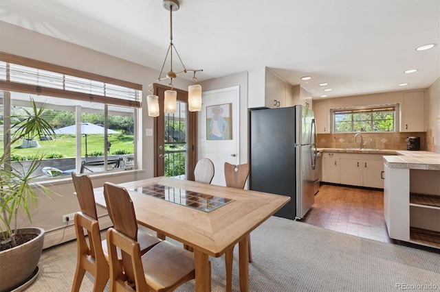 dining space featuring recessed lighting and light wood-type flooring