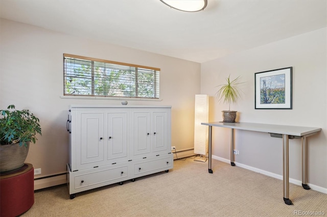 office area featuring light colored carpet, a baseboard heating unit, and baseboards