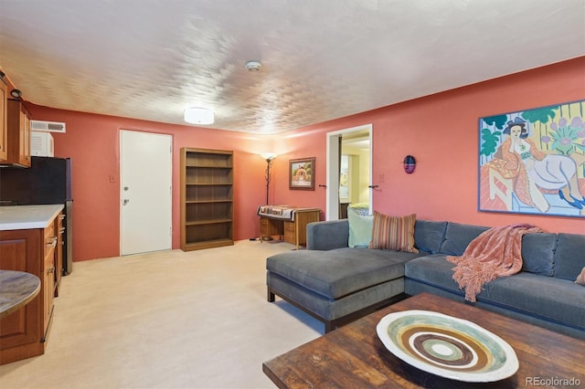 living room featuring light carpet