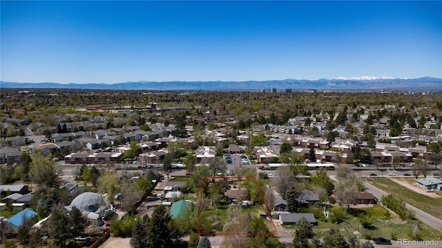 aerial view of residential area featuring a mountain backdrop