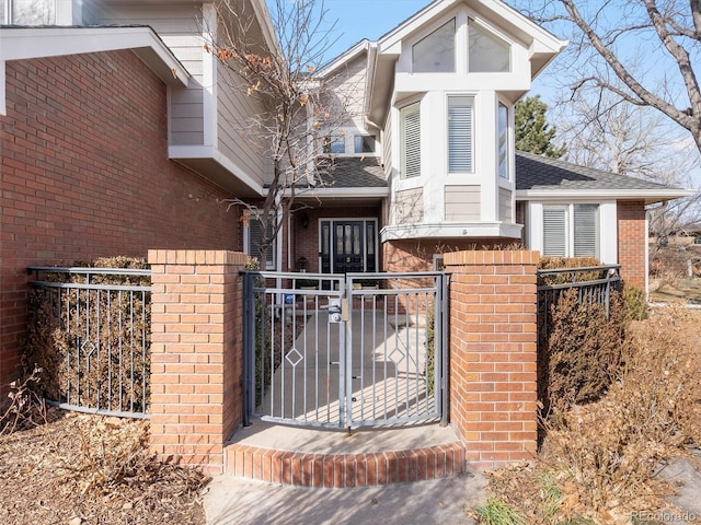 view of gate with fence