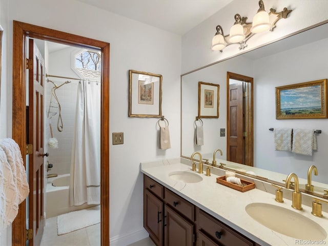 bathroom featuring double vanity, shower / tub combo, and a sink