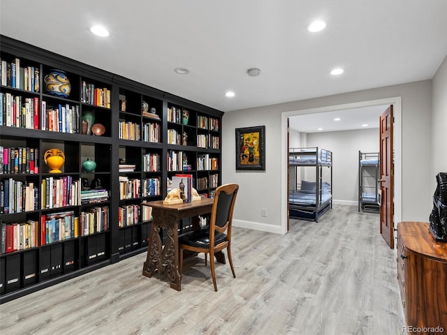 office featuring light wood finished floors, baseboards, and recessed lighting