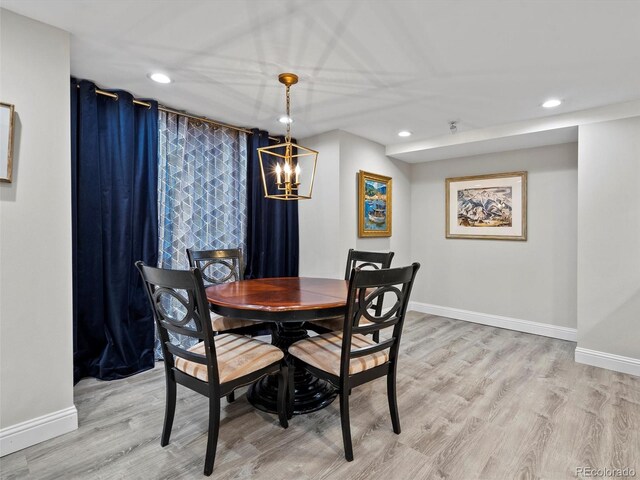 dining area featuring light wood-style floors, baseboards, and recessed lighting