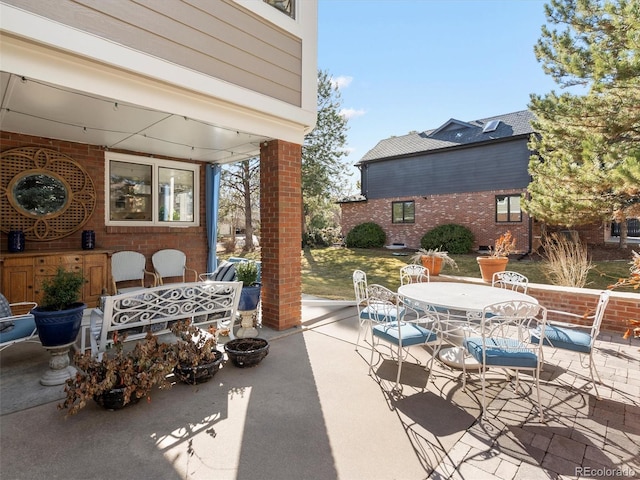 view of patio featuring outdoor dining area