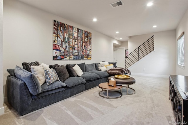 living area with stairs, carpet floors, baseboards, visible vents, and recessed lighting