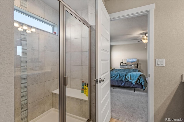 244 Chipeta Way, Lochbuie, CO 80603 - bathroom with connected bathroom, a textured wall, a ceiling fan, and a shower stall